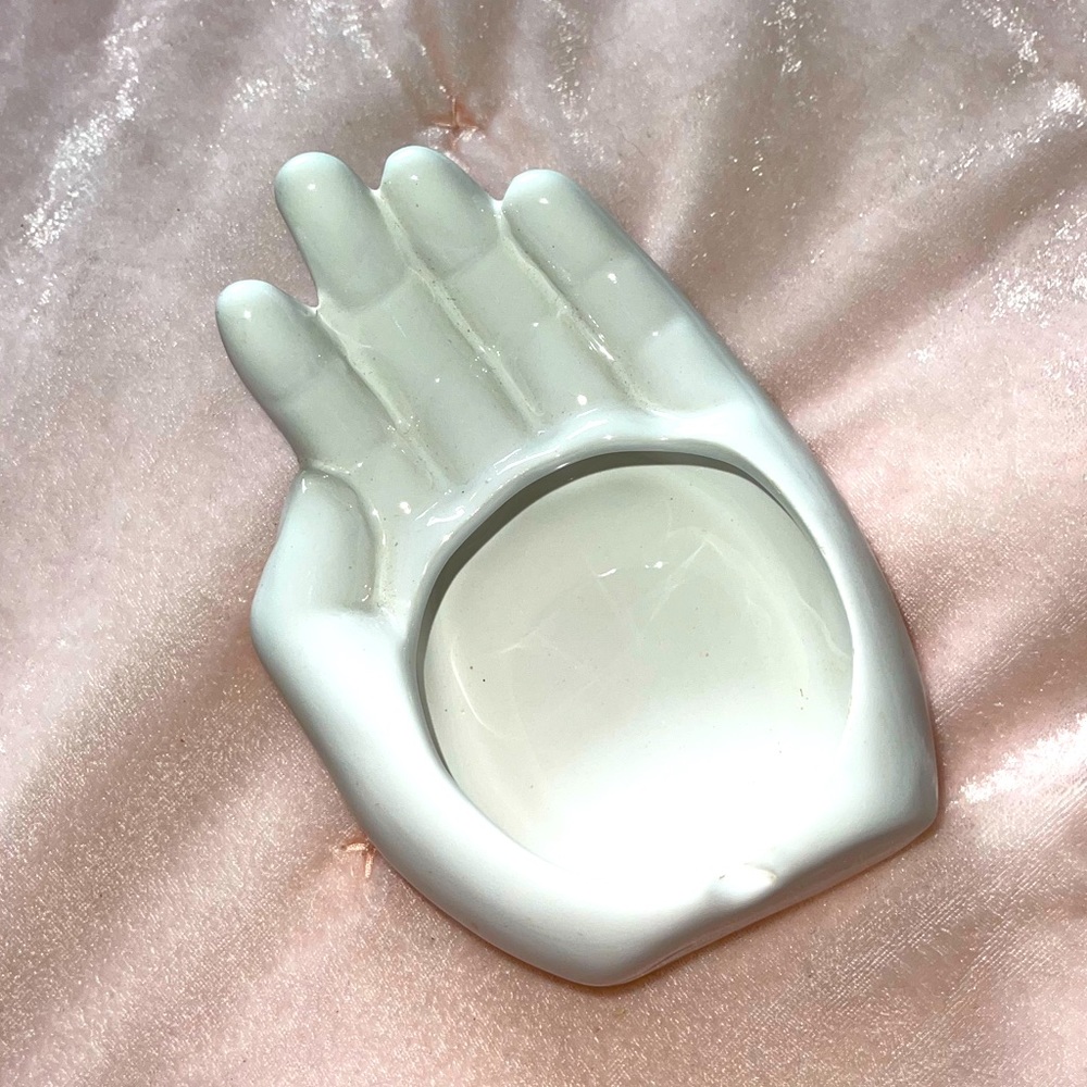 White, hand shaped jewelry holder.